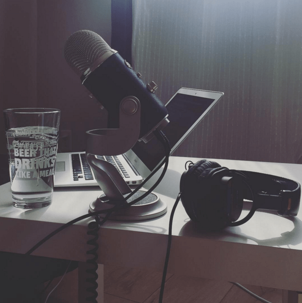 image of laptop and microphone ready for a podcast session