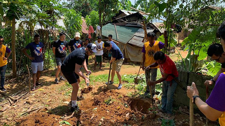 Addam on a vto trip building houses in Cambodia