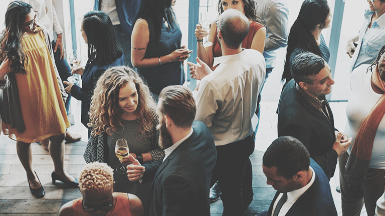 hip people talking and enjoying cocktails
