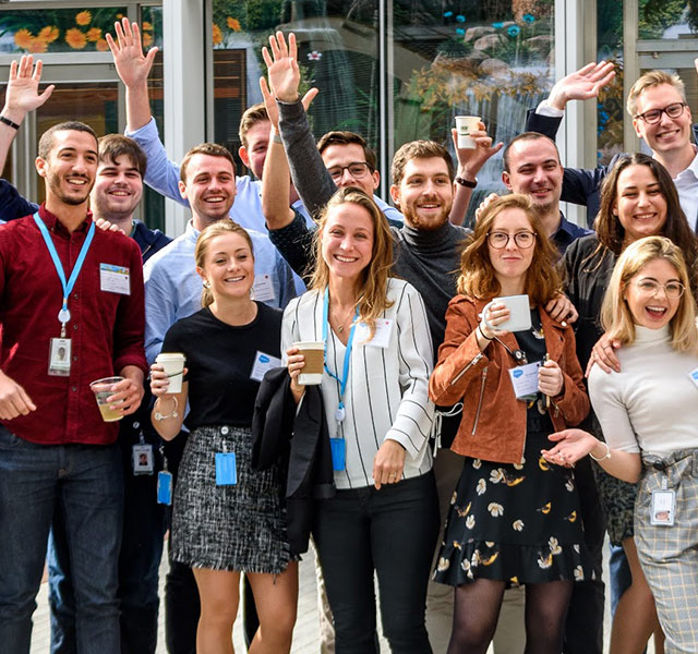 a group of futureforce interns waving to the camera
