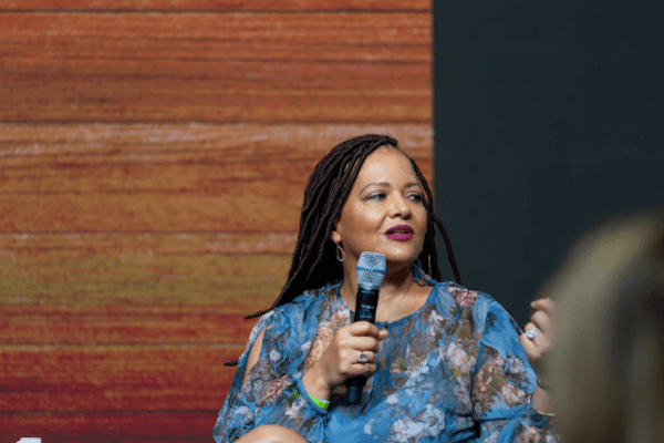 Cristina Jones, SVP, Customer Marketing, Brand Partnership, & C-Suite Engagement speaking onstage at the Trailblazing Women Summit in 2019