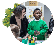 teacher with young child in a classroom