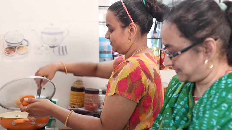 Tejaswi Attot in the kitchen with her mother