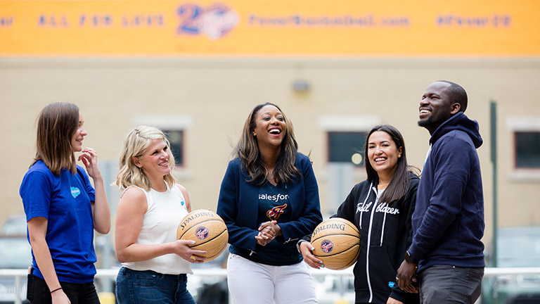 Bunmi Akintomide laughing with a group of people