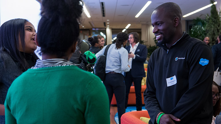 Bunmi Akintomide laughing with a group of people